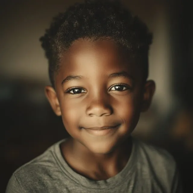The photograph that was uploaded: a young boy smiling at the camera.